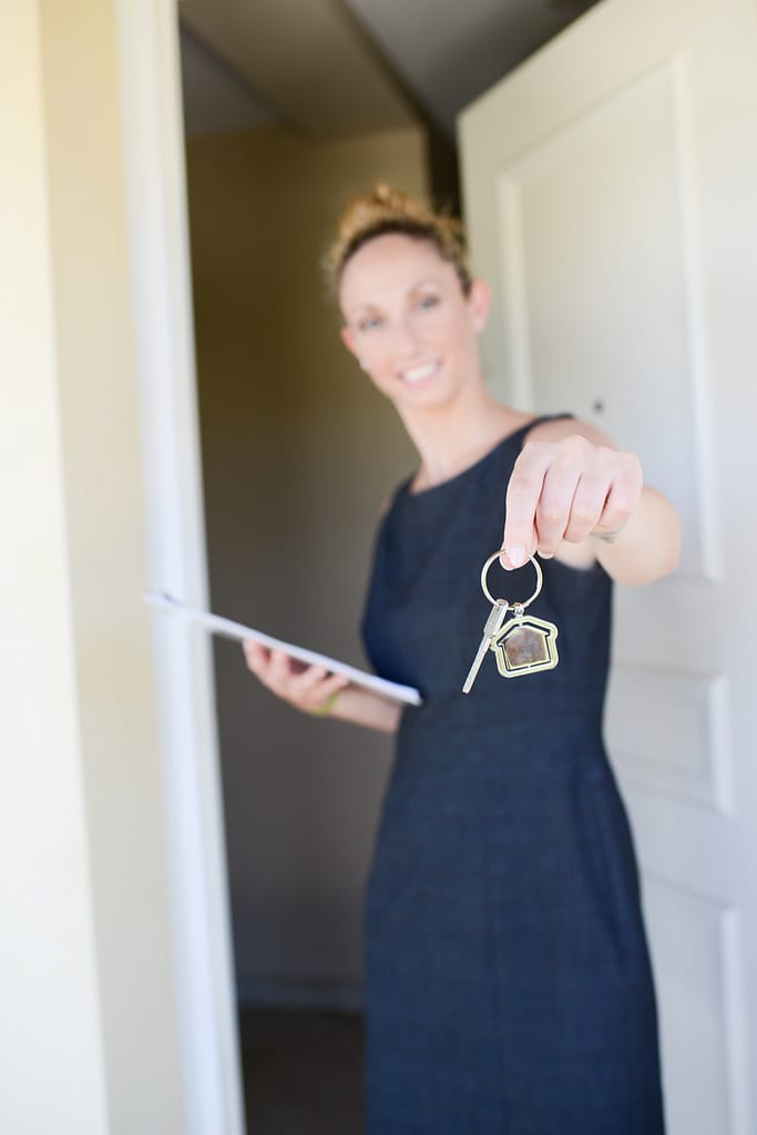 A short term rental property manager welcoming guests